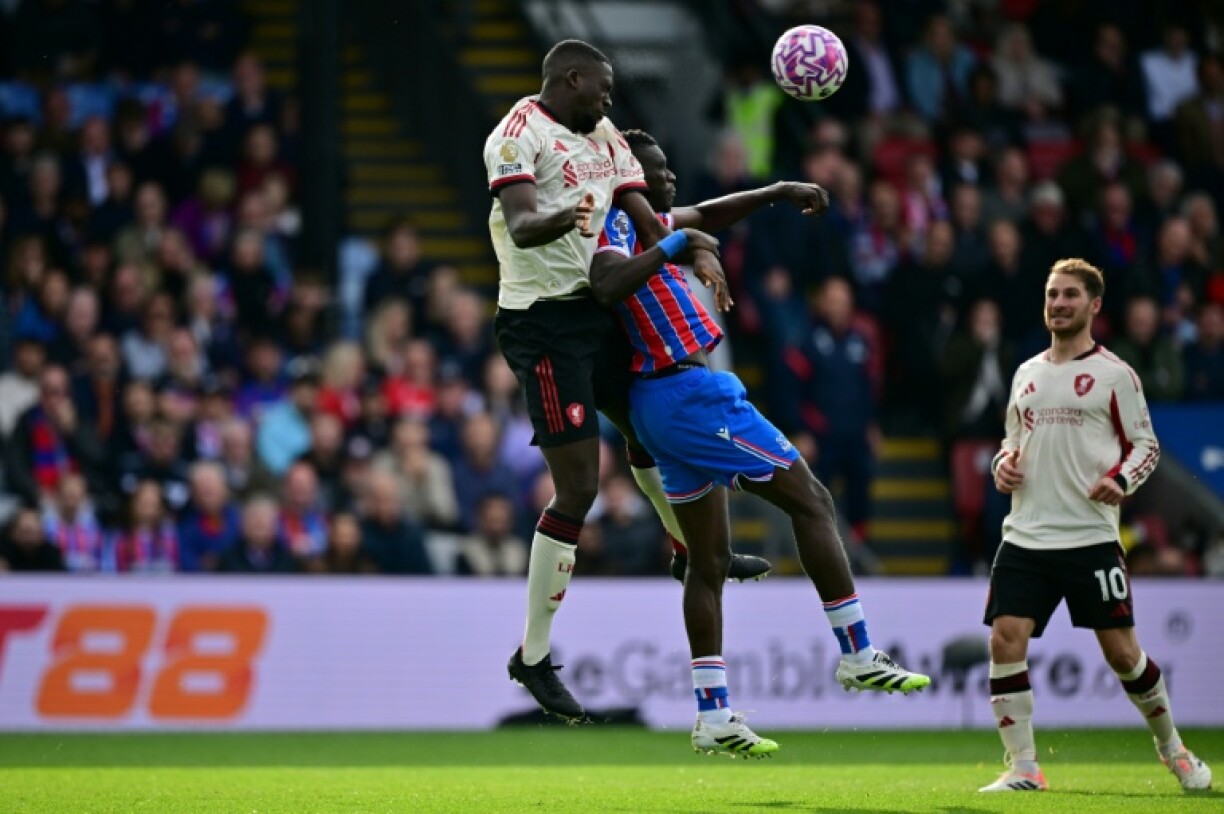 Crystal Palace forward Ismaila Sarr (C) in an aerial duel with Liverpool defender Ibrahima Konate at Selhurst Park.