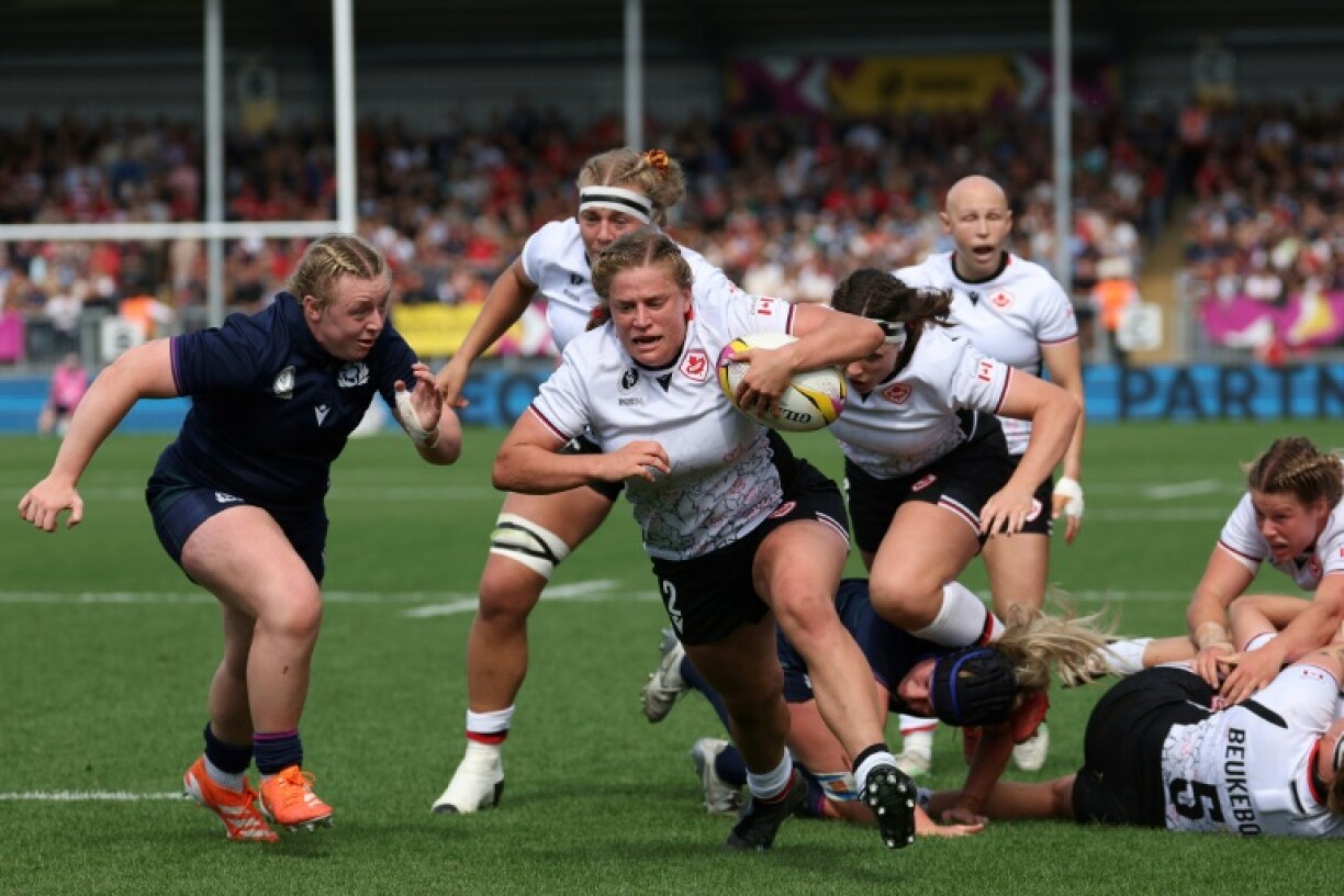Canada hooker Emily Tuttosi runs in a try during a 40-19 Women's Rugby World Cup Pool B win over Scotland in Exeter