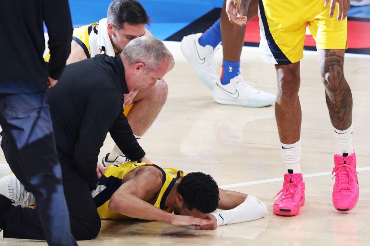 Tyrese Haliburton is consoled after suffering a game-ending injury in Indiana's NBA Finals loss to Oklahoma City