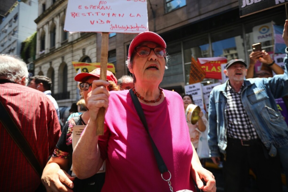 Alicia Ceresoli, an 80-year-old pensioner, protests outside the headquarters of PAMI, the agency that manages retiree benefits, in Buenos Aires on December 4, 2024