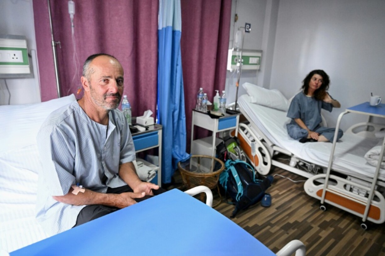 French climbers Didier Armand Berton (L) and Isabelle Thaon recounted from a Kathmandu hospital how they survived an avalanche that killed seven of their group