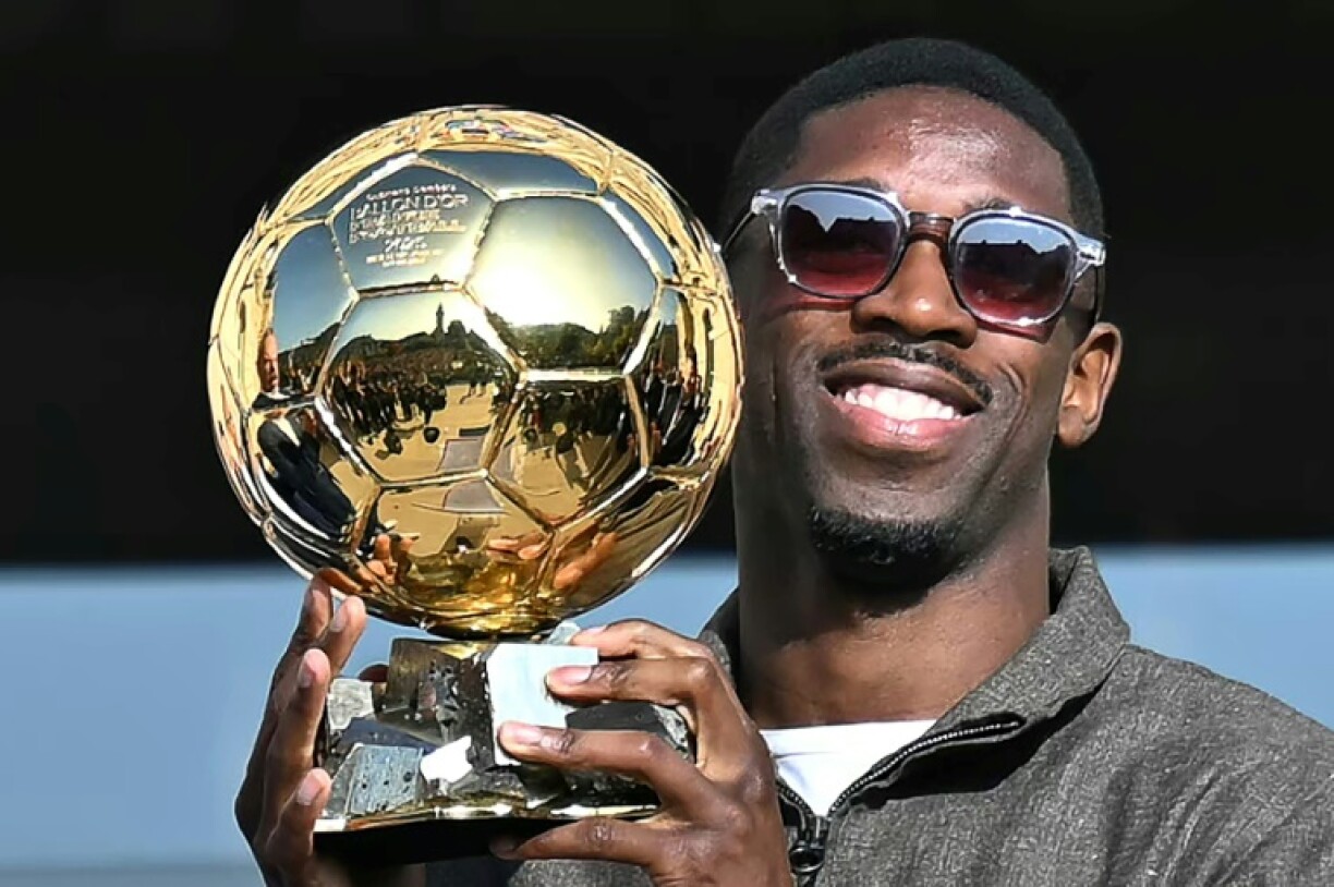 Ousmane Dembele shows off the Ballon d'Or trophy in his home town of Evreux earlier this month