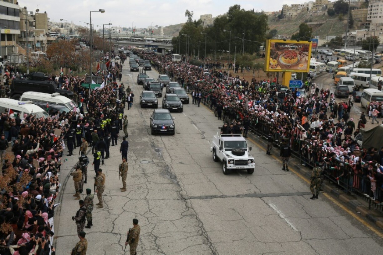 The crowds gathered despite cold and rain, many with placards expressing support for the position of King Abdullah II on Gaza