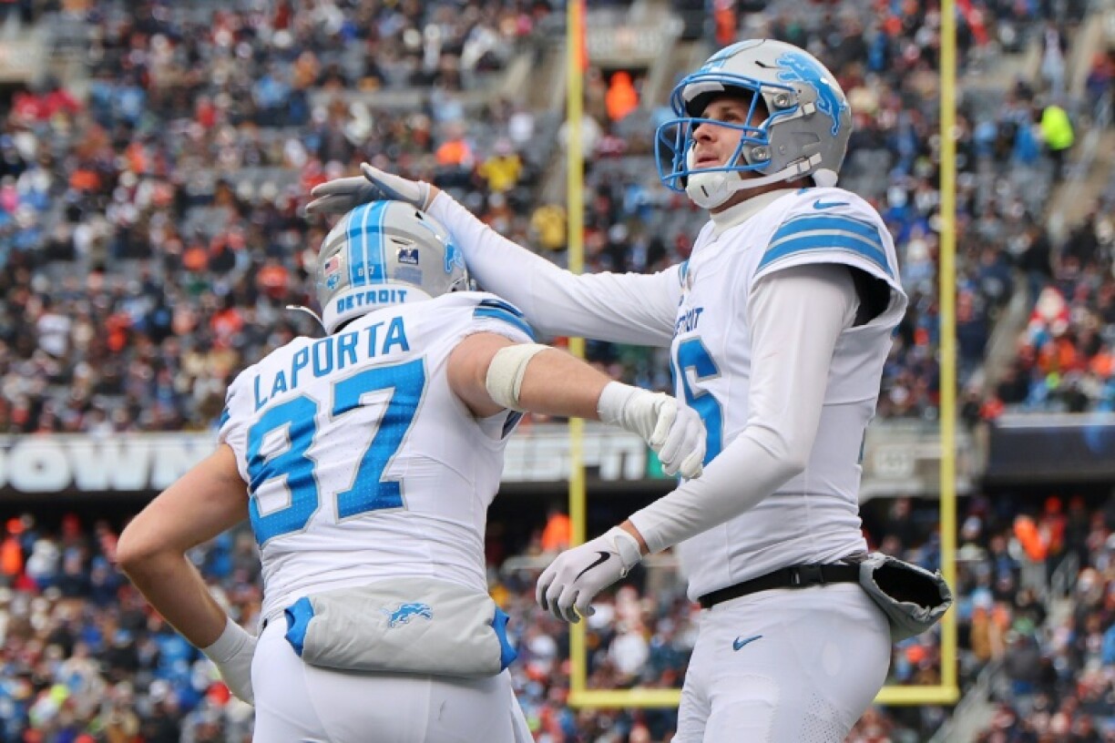 Sam LaPorta and Jared Goff of the Detroit Lions celebrate a touchdown in the team's NFL victory over the Chicago Bears