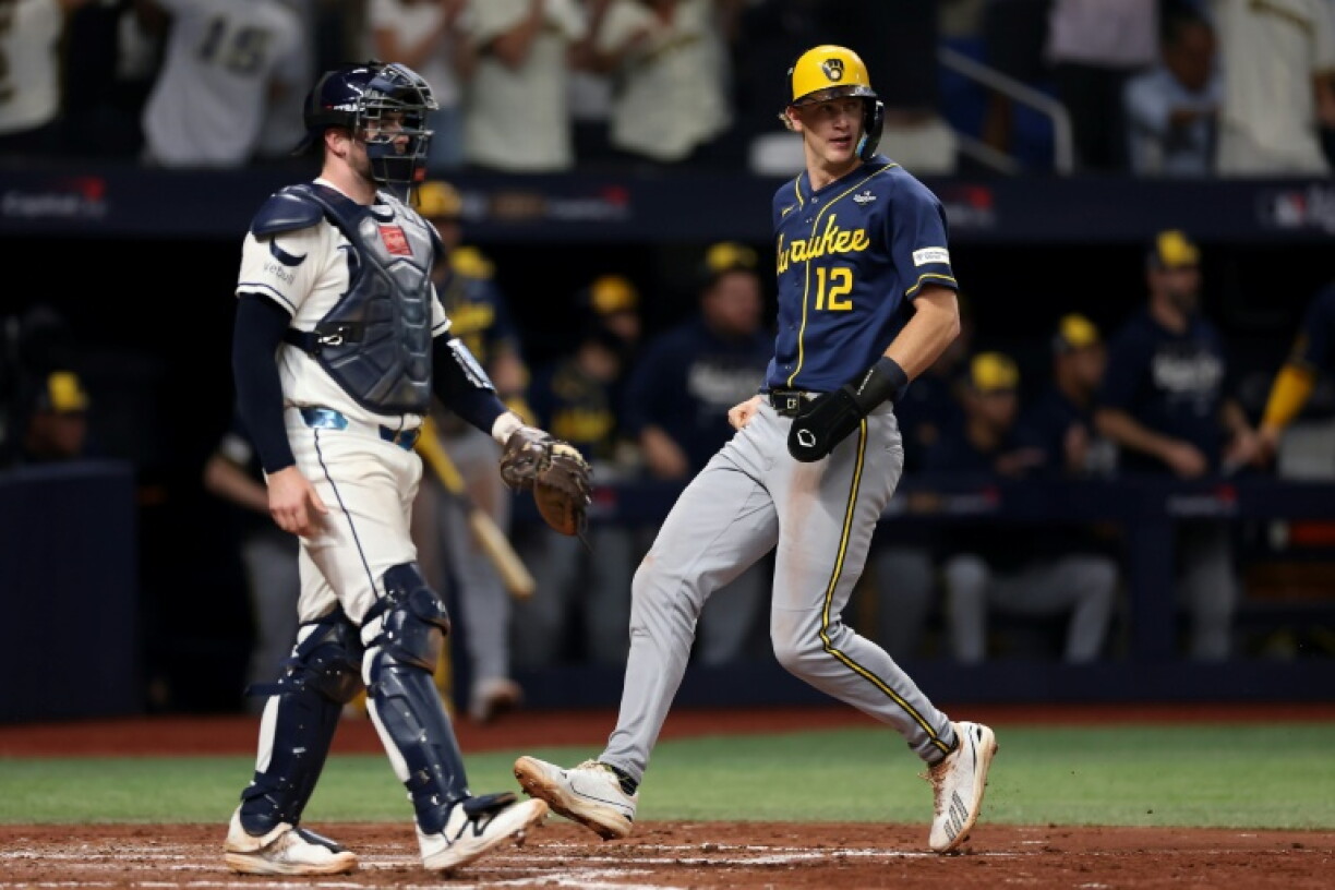 Milwaukee's Cooper Pratt scores a run in the Brewers' World Series-clinching win over the Tampa Bay Rays