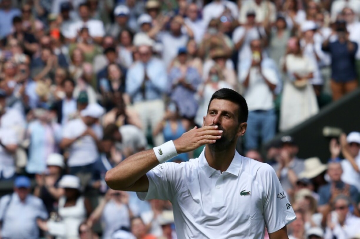 Novak Djokovic celebrates victory over Dan Evans