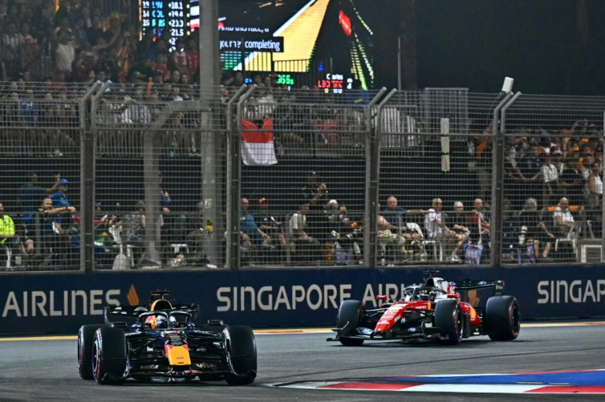 Max Verstappen leads Charles Leclerc during the Formula One Singapore Grand Prix at the Marina Bay Street Circuit