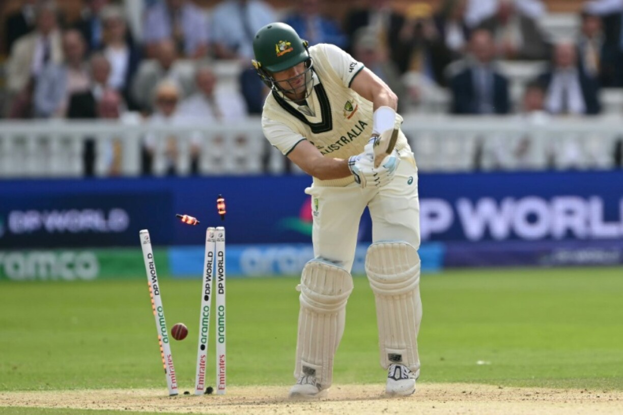 Australia's captain Pat Cummins is bowled by South Africa's Lungi Ngidi