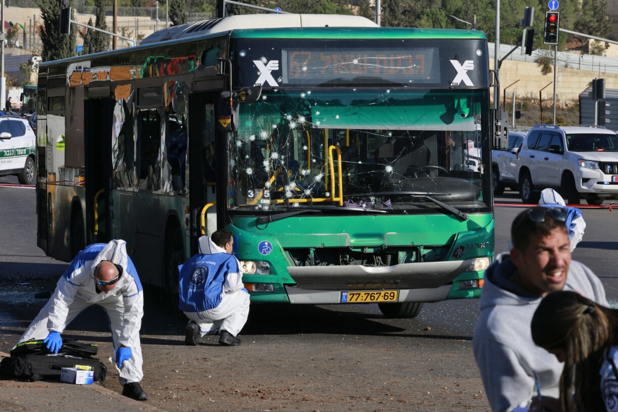 sraeli forensic experts work at the scene of an explosion at a bus stop in Jerusalem on November 23, 2022.