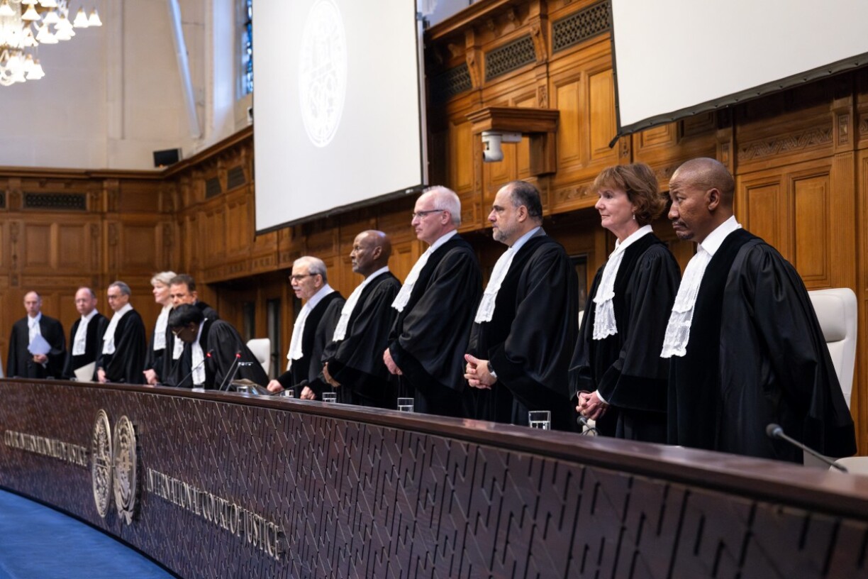 (From R) Judge Dire Tladi, Judge Sarah Cleveland, Judge Leonardo Nemer Caldeira Brant, Judge Georg Nolte, Judge Abdulqawi Ahmed Yusuf, Judge Nawaf Salam rise during a hearing at the International Court of Justice (ICJ) as part of South Africa's request on a Gaza ceasefire in The Hague, on May 24, 2024, amid the ongoing conflict between Israel and the Hamas movement. International Court of Justice (ICJ) orders Israel to 'immediately halt' offensive in Rafah, as part of South Africa's request on a Gaza ceasefire in The Hague, on May 24, 2024.