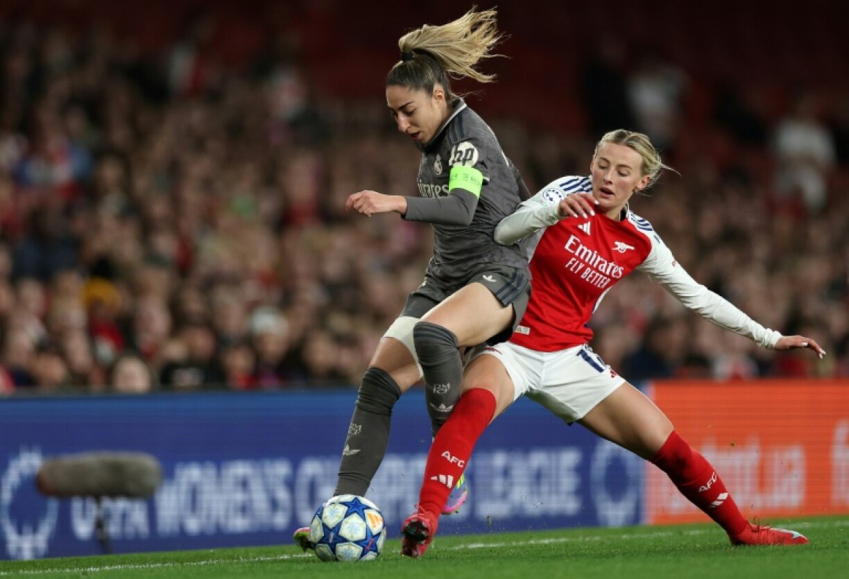 Olga Carmona (L) in action against Arsenal during the Women's Champions League quarter-finals in March