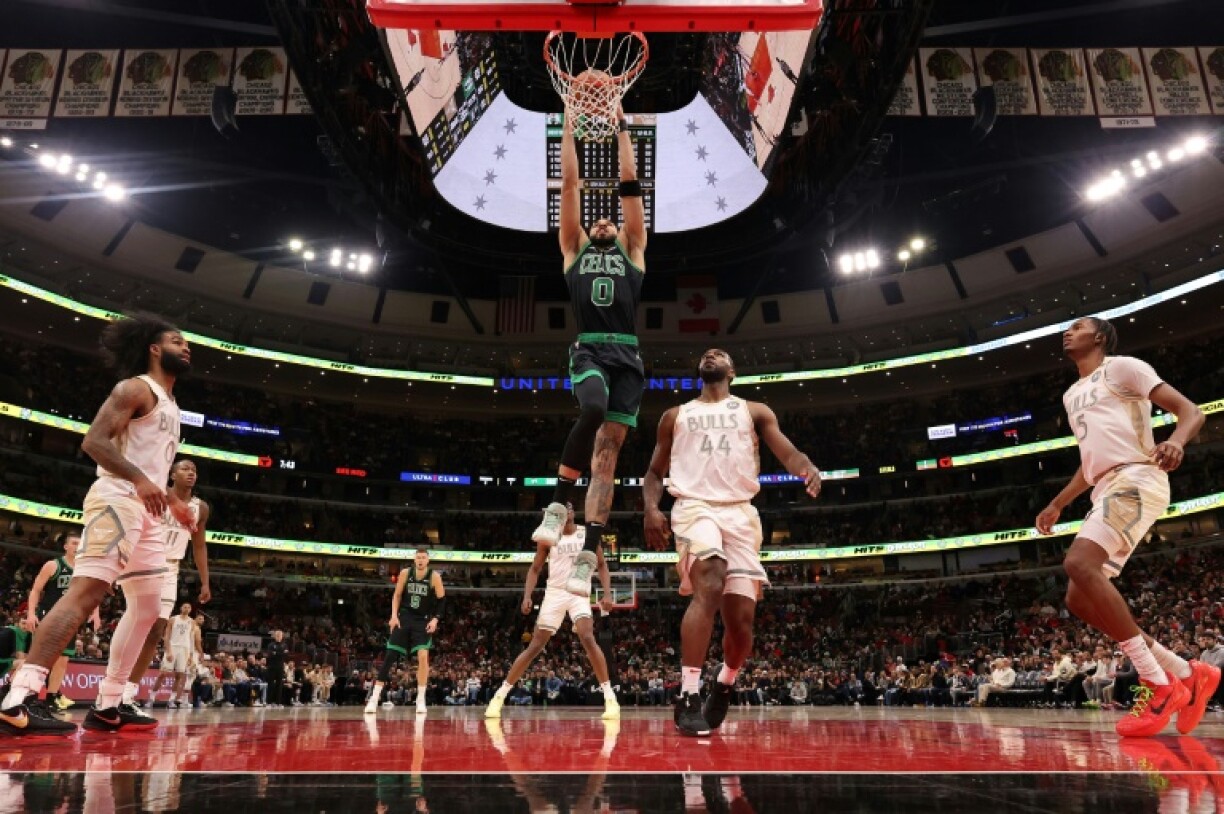 Jayson Tatum of the Boston Celtics throws down a dunk in the Celtics' NBA victory over the Chicago Bulls