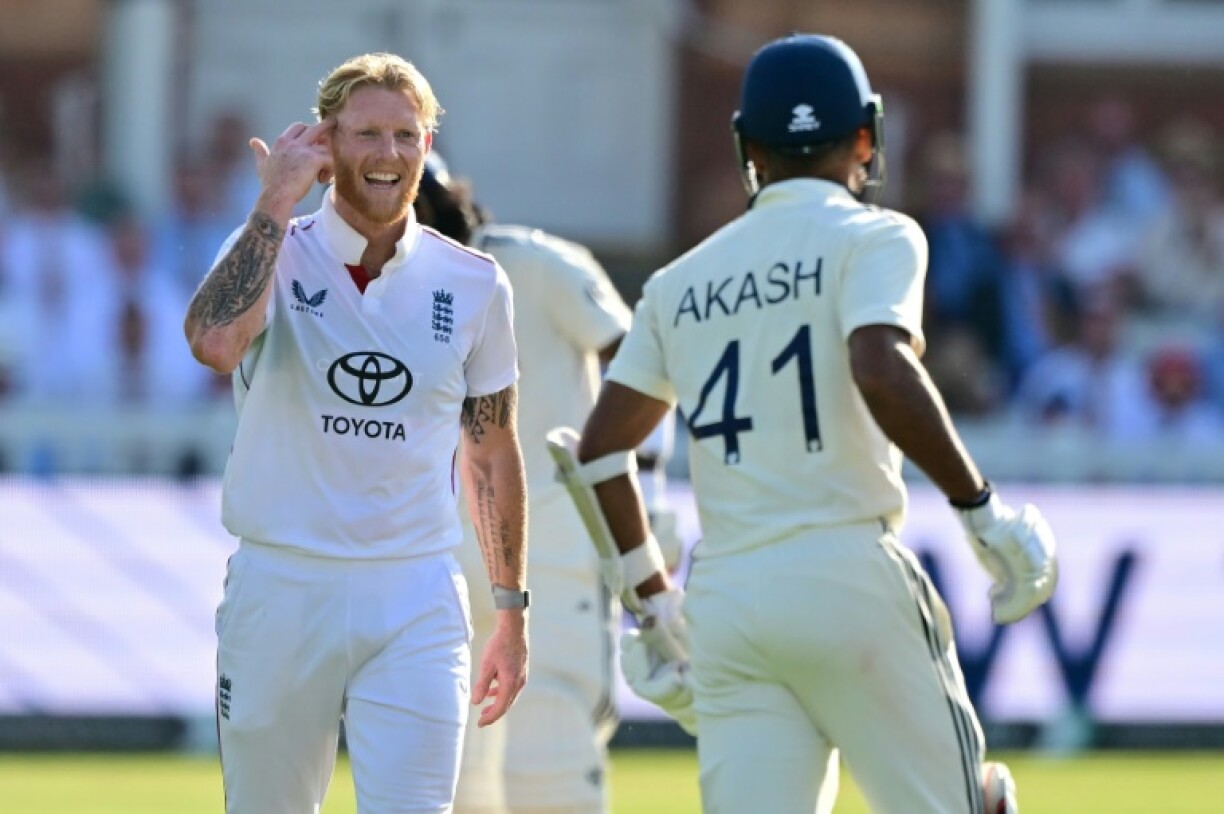 England captain Ben Stokes (L) gestures to India's Akash Deep