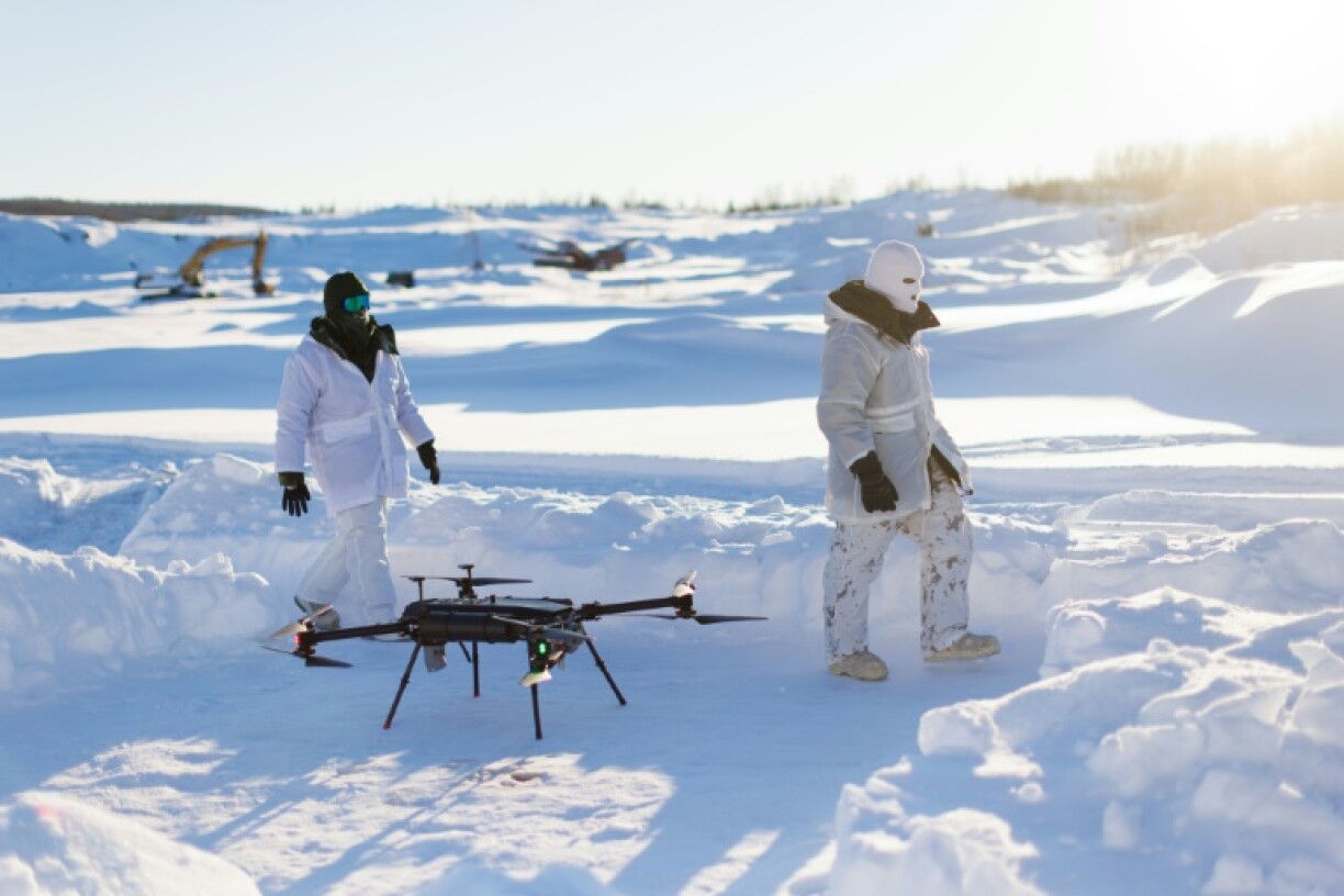 A Canadian soldier sits on a snow mobile during Operation Nanook, army's annual Arctic training operation, in Tuktoyaktuk, Canada in February 2025
