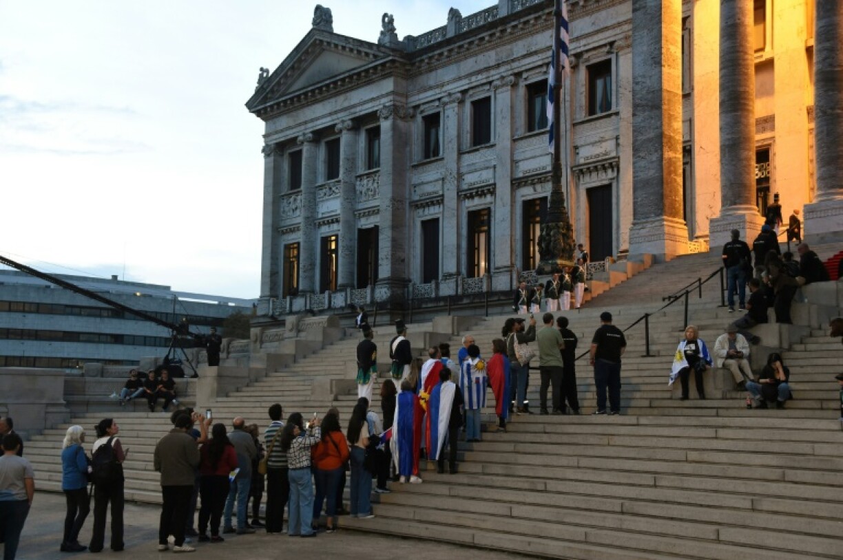 Thousands of Uruguayans lined up to file past the coffin and sign a condolence book at the parliamentary building