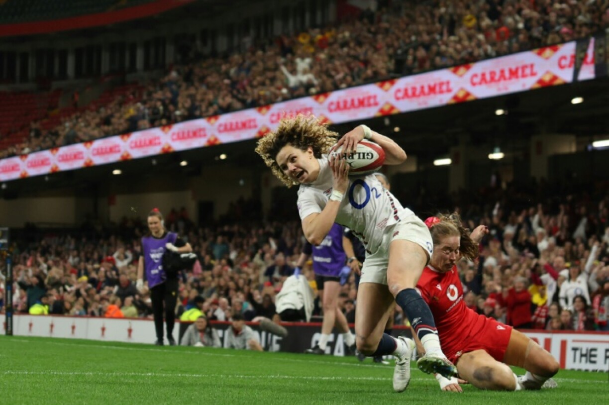 Try time: England full-back Ellie Kildunne scores one of her three tries in a Women's Six Nations win over Wales in Cardiff