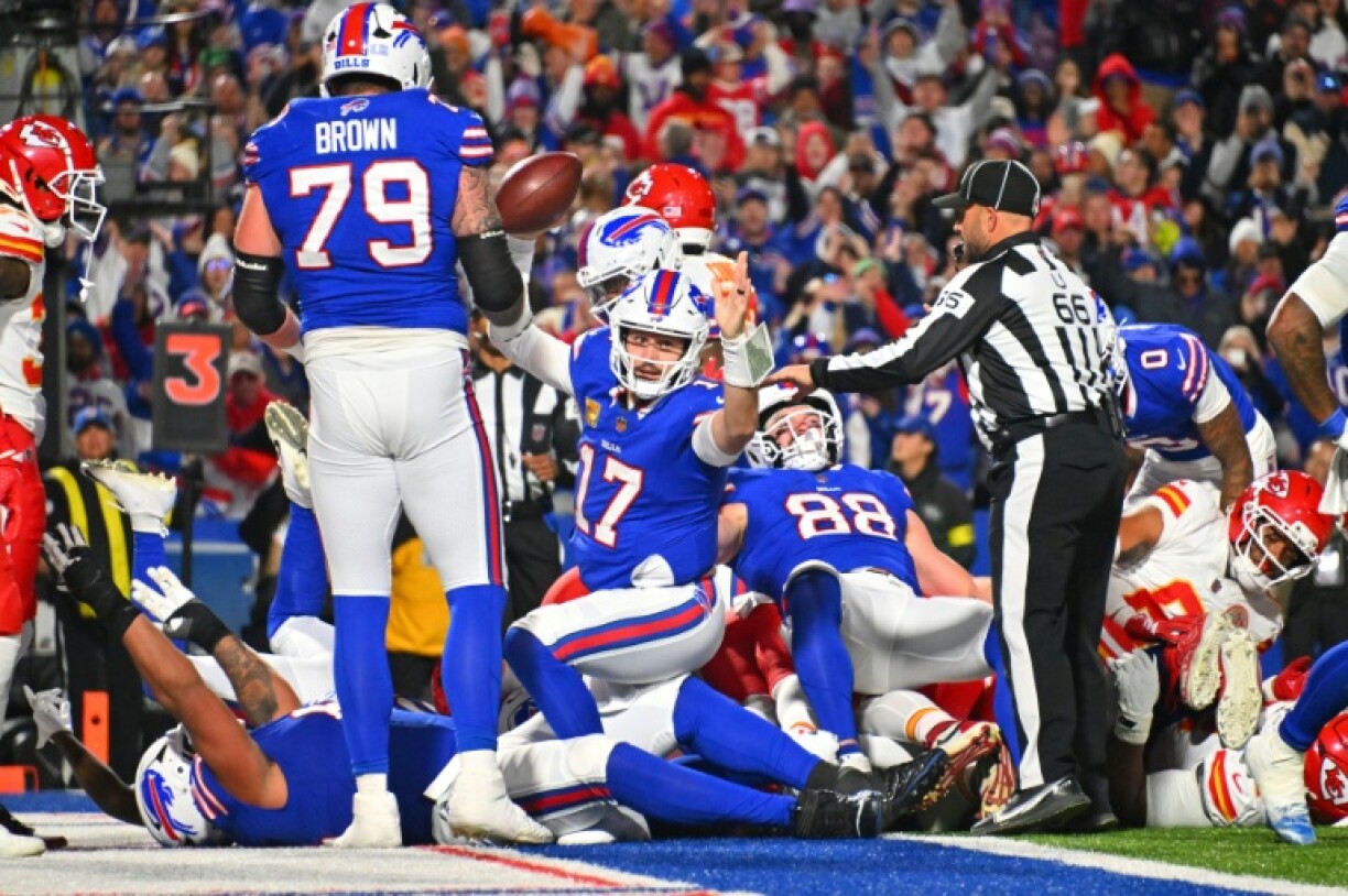 Buffalo's Josh Allen, center, scored on a one-yard touchdown run to help spark the Bills over Kansas City 28-21 in an NFL game