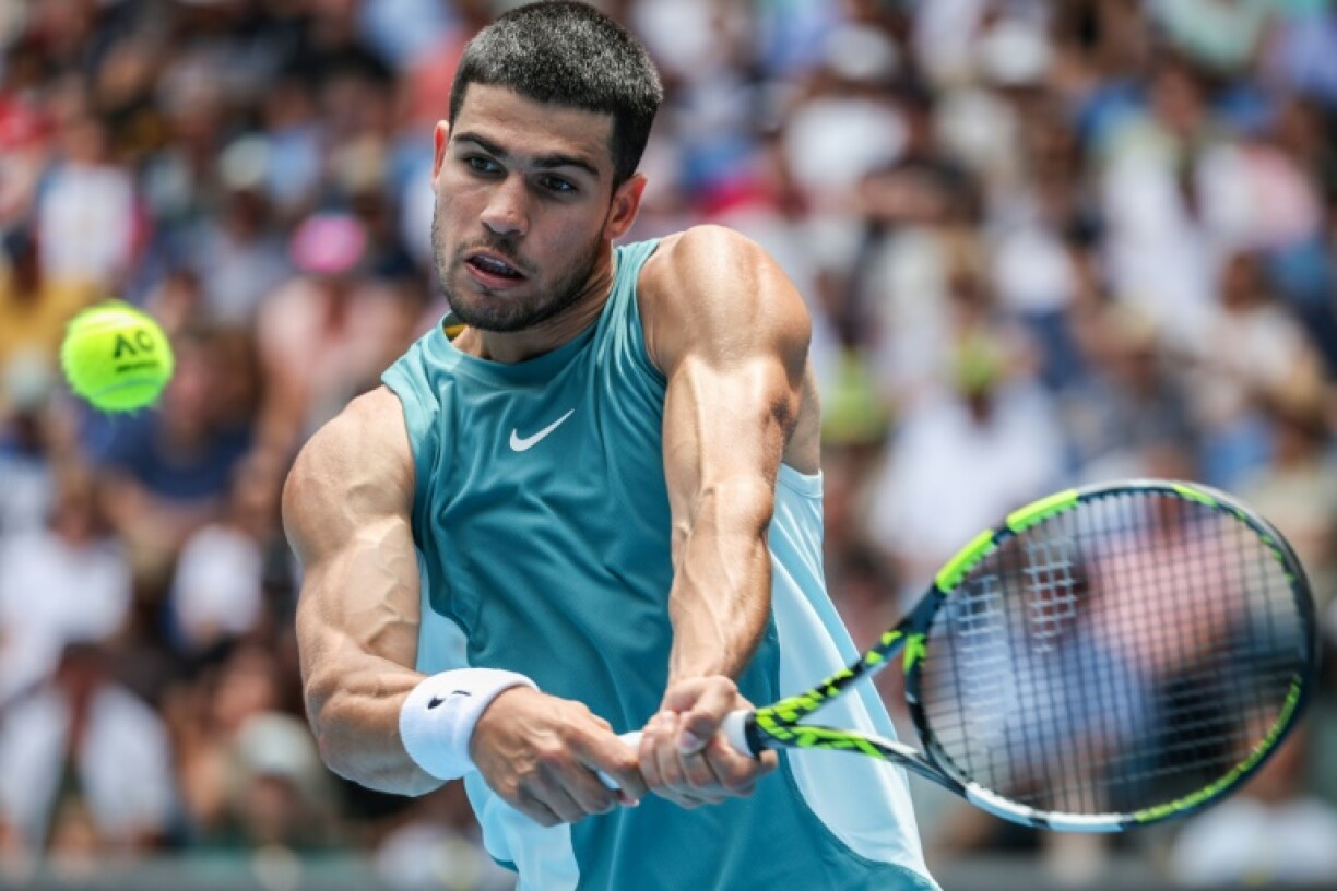 Spain's Carlos Alcaraz hits a return against Japan's Yoshihito Nishioka at the Australian Open