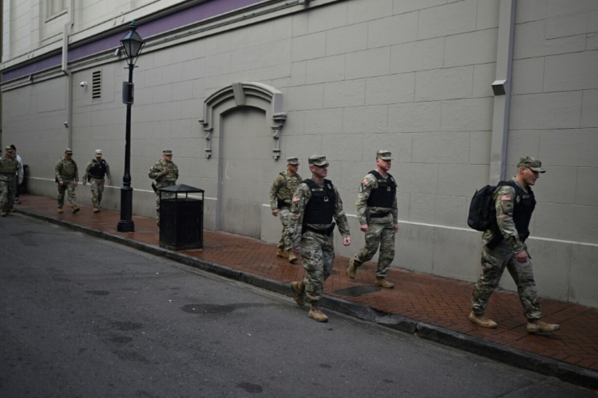 Members of the National Guard walk through the French Quarter in New Orleans after the truck attack