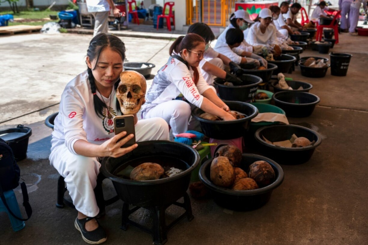 The ritual involves brushing dirt and flesh from the remains and washing them in holy water boiled with tea leaves