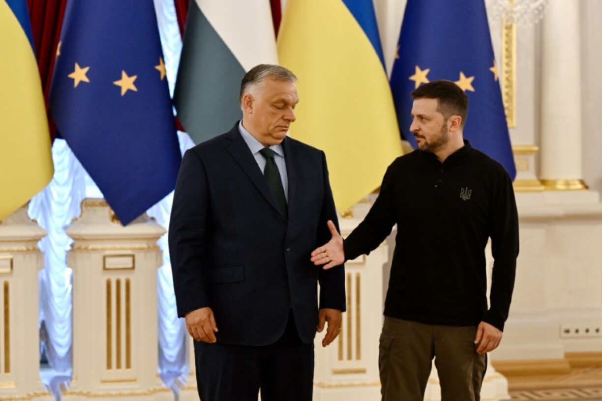 Hungary's Viktor Orban, left -- Moscow's closest friend in the EU -- has not hid his hostility to the bid by Ukraine's Volodymyr Zelensky to join the bloc