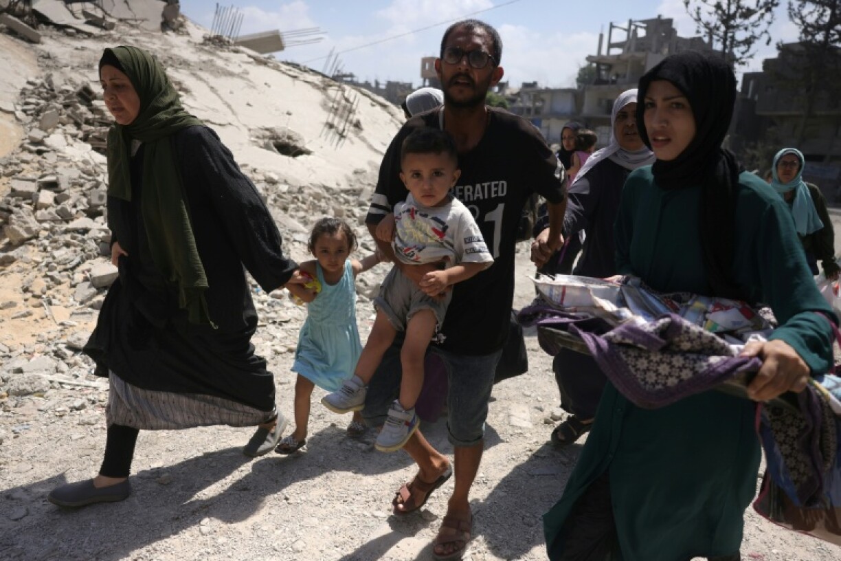Palestinians flee Jabalia in the northern Gaza Strip as Israeli preparations to seize Gaza City intensify.
