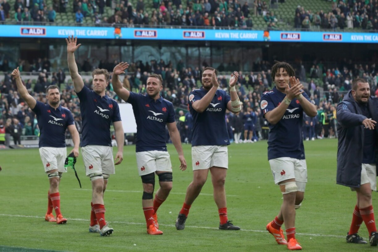 The France players celebrate on the field at Lansdowne Road after a stunning 42-27 win over Ireland in the Six Nations