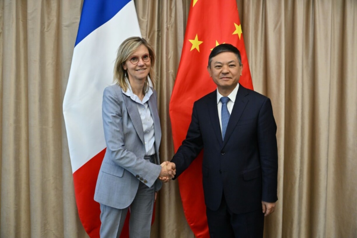 France's minister for ecological transition Agnes Pannier-Runacher (L) met several Chinese officials during her visit, including Environment Minister Huang Runqiu (R)