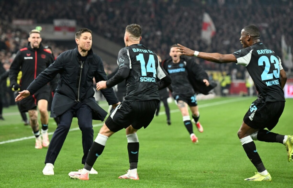 Xabi Alonso celebrates with his Bayer Leverkusen side after their comeback win over Stuttgart