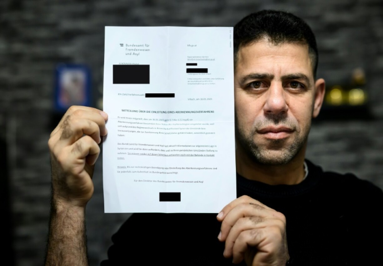 'What have we done?' Syrian refugee Khaled Alnomman with the letter threatening his family's asylum status