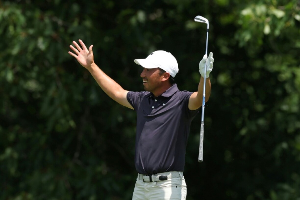 American Doug Ghim States reacts after holing out from the fairway at the 15th hole on the way to the halfway lead in the US PGA Tour John Deere Classic