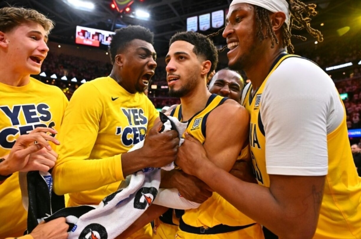 Tyrese Haliburton is mobbed by his Indiana team-mates after his winning three-pointer put the Pacers 2-0 up in their best-of-seven series against Cleveland