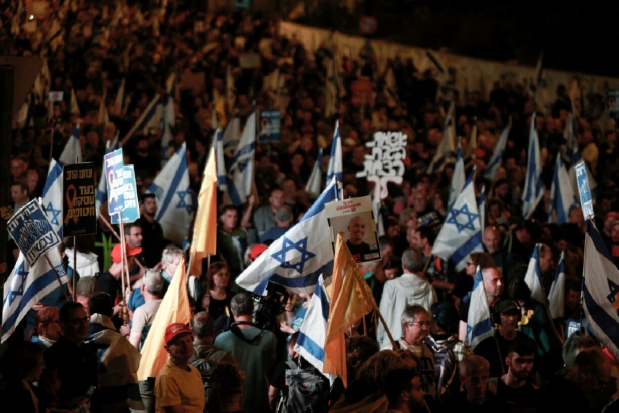 Israelis rally outside the parliament in Jerusalem on March 26, 2025, calling for an end to the war in Gaza, the return of all the hostages held by Hamas and against judicial reforms