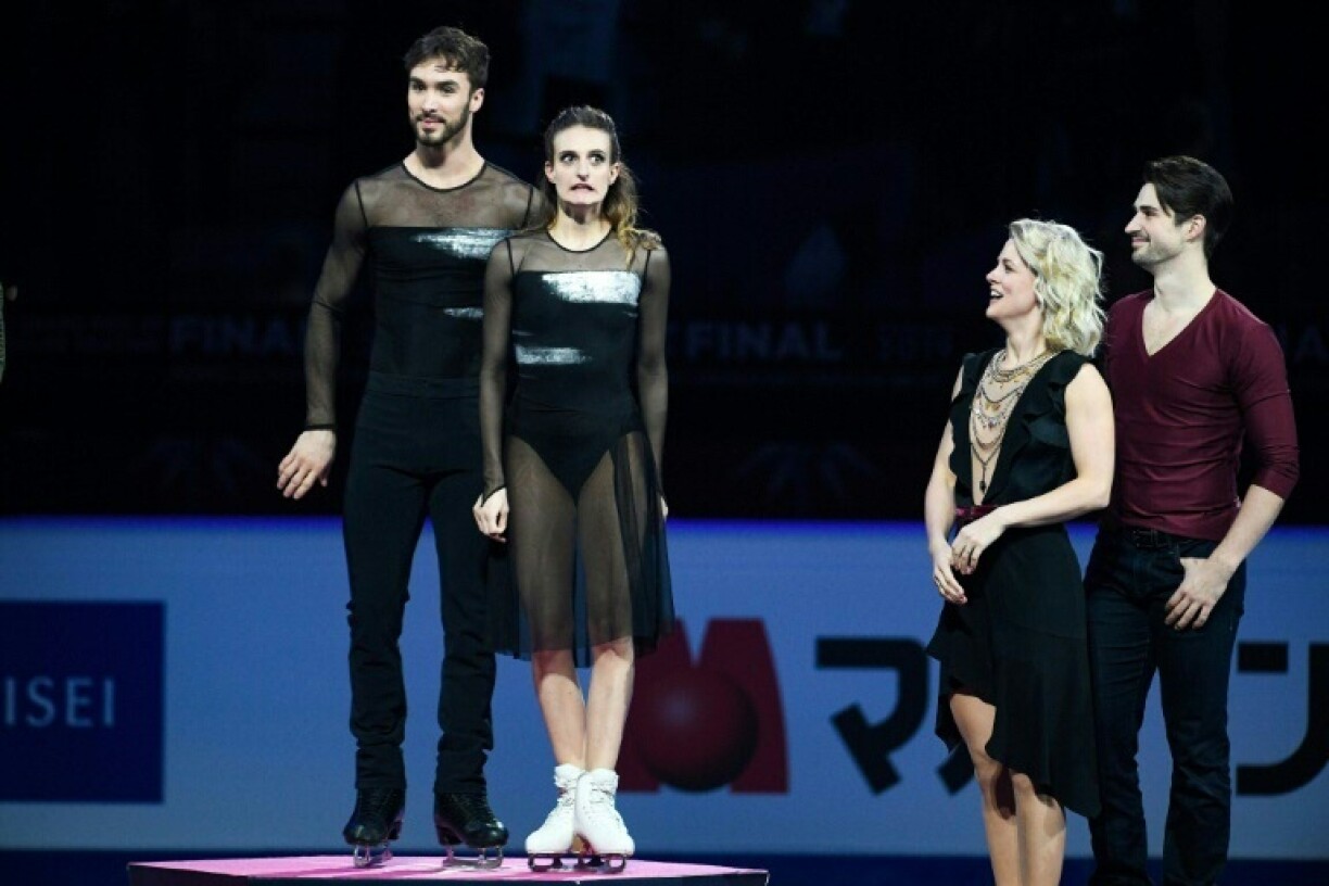 France's Gabriella Papadakis (2nd L) jokes with Guillaume Cizeron (L), and US pair Madison Hubbell and Zachary Donohue (R) at the ISU Grand Prix Final 2019 in Turin