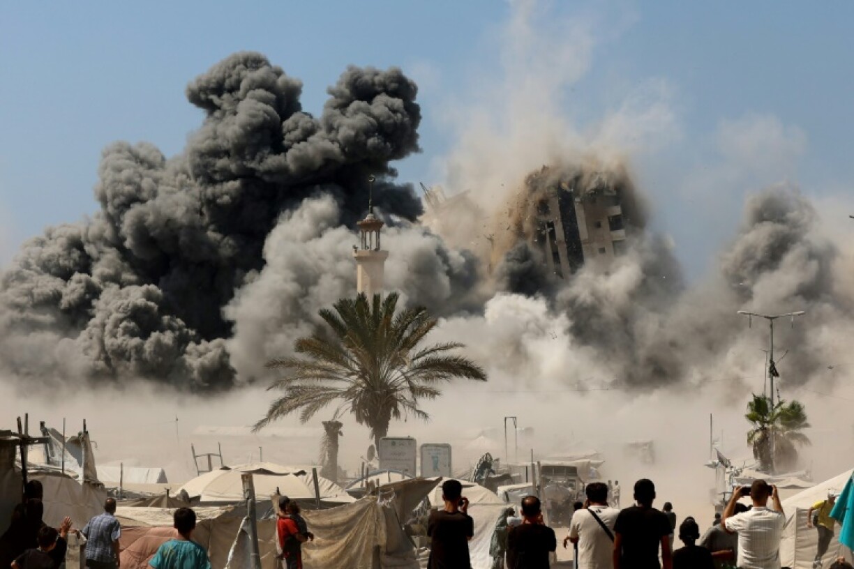 Mushtaha Tower in Gaza City collapses after an Israeli strike on Friday