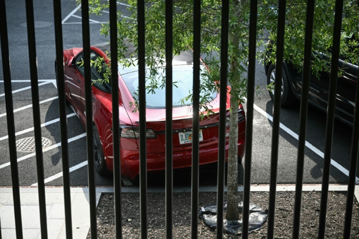 A Tesla vehicle is parked on West Executive Avenue outside the White House near the Eisenhower Executive Office Building in Washington, DC, on June 5, 2025