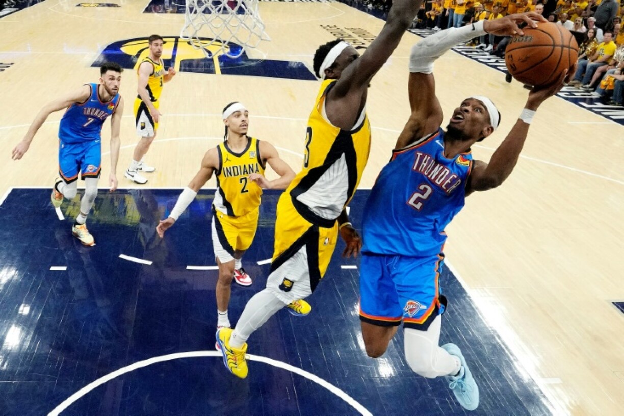 Shai Gilgeous-Alexander of the Oklahoma City Thunder attempts a shot against Pascal Siakam of the Indiana Pacers in game six of the NBA Finals