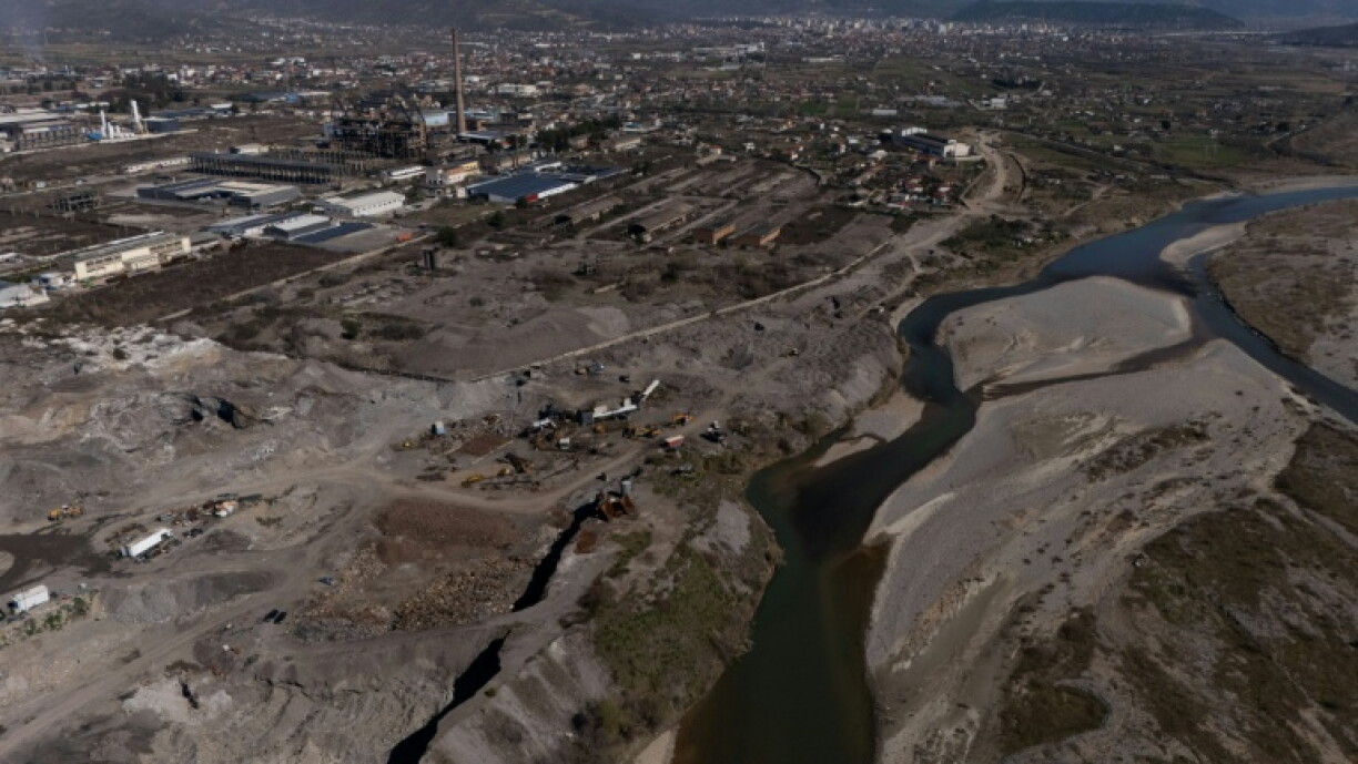 Machines work amid the huge waste dumps of Albania's Elbasan steelworks