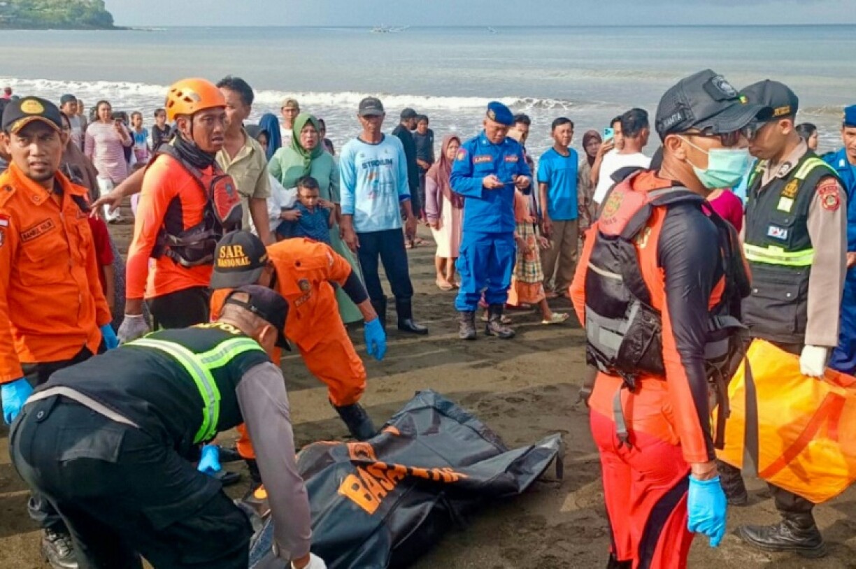 Rescuers move a victim's body recovered by fishermen in Banyuwangi, East Java, in a picture published by the Indonesia's National Search and Rescue Agency