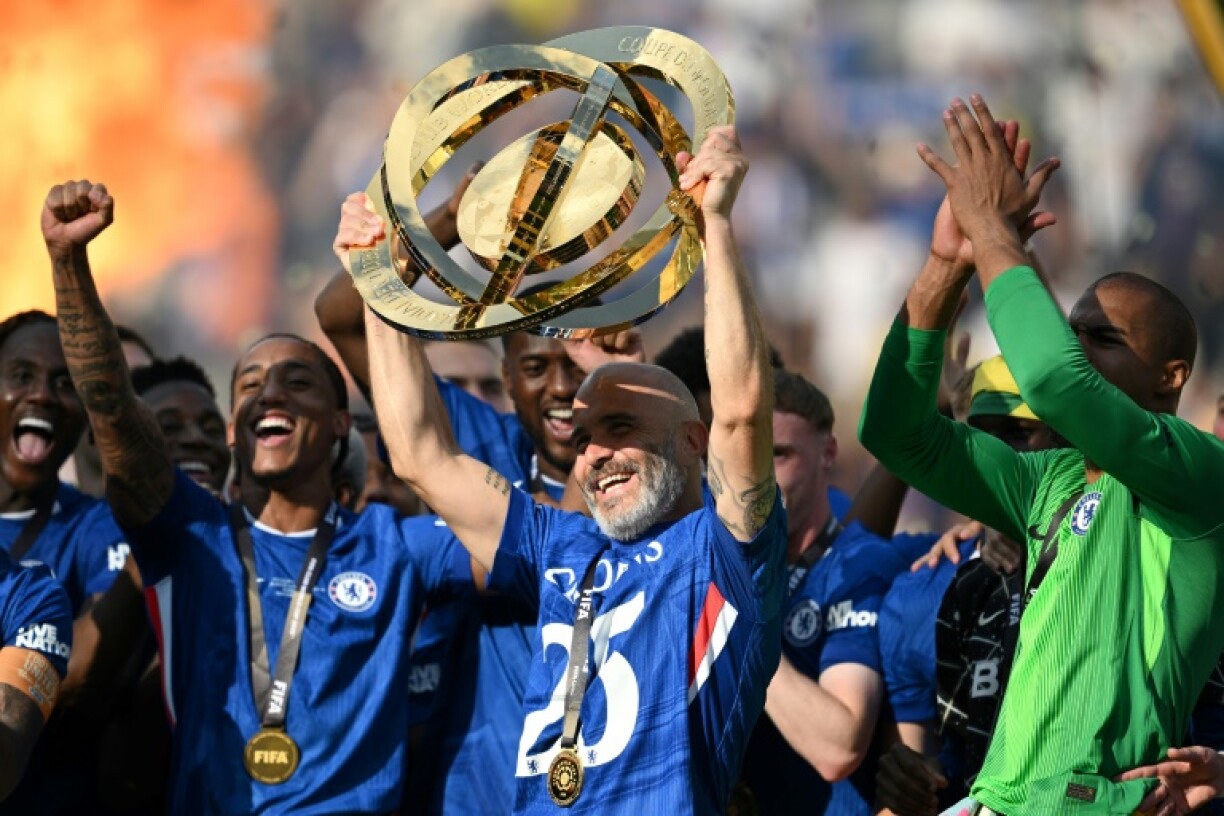 Chelsea coach Enzo Maresca lifts the trophy after his team beat Paris Saint-Germain in Sunday's Club World Cup final