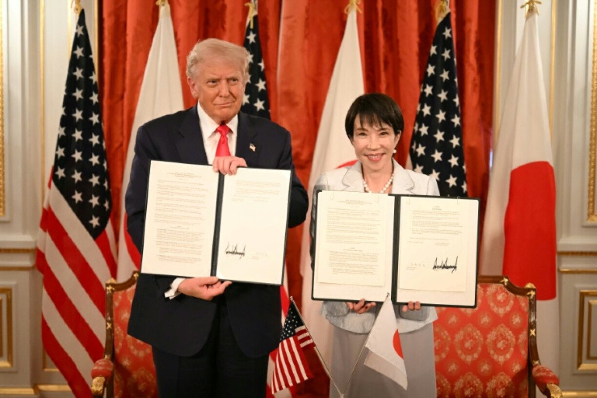 Japan's Prime Minister Sanae Takaichi (R) and US President Donald Trump attend a signing ceremony after a Japan-US Summit at the Akasaka State Guest House in Tokyo on October 28, 2025.