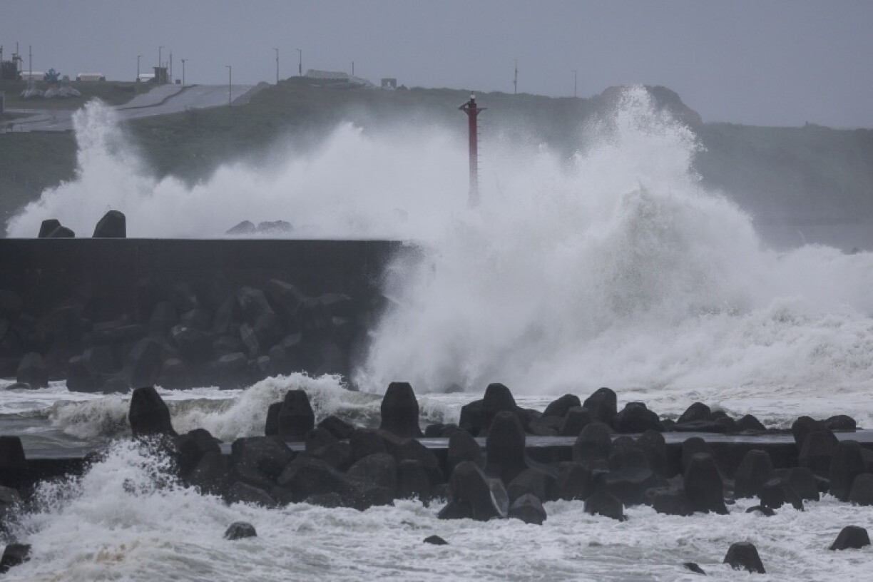 Waves crash against concrete wave breakers along the coast as Typhoon Champi approaches Taiwan, in Keelung on October 23