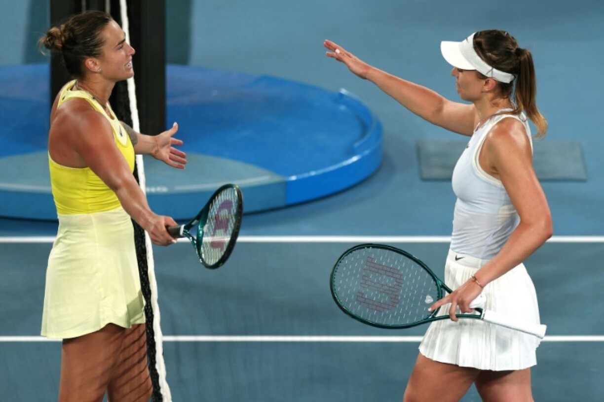 Aryna Sabalenka (L) greets Spain's Paula Badosa after their match