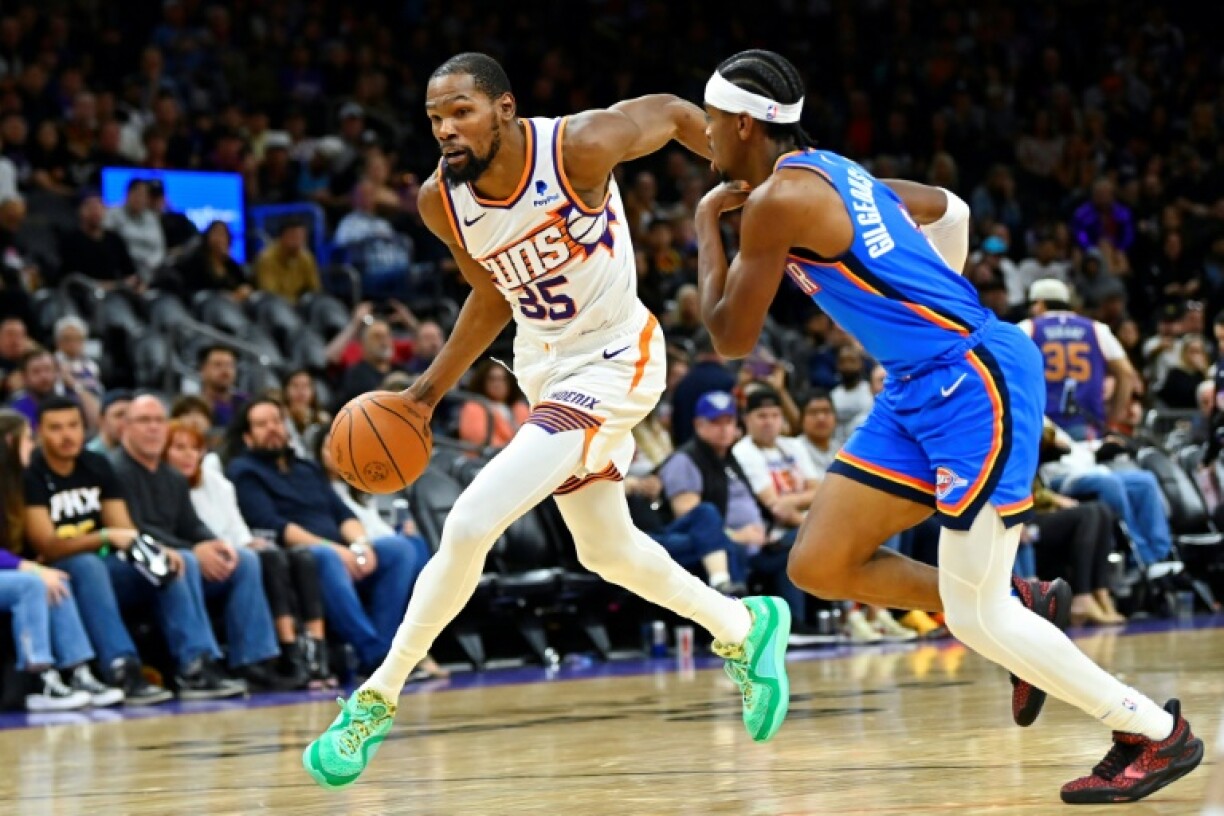 Houston Rockets star Kevin Durant, left, and reigning NBA Most Valuable Player Shai Gilgeous-Alexander of Oklahoma City, right, are set to meet in the opening game of the NBA's 2025-26 campaign, the league announced