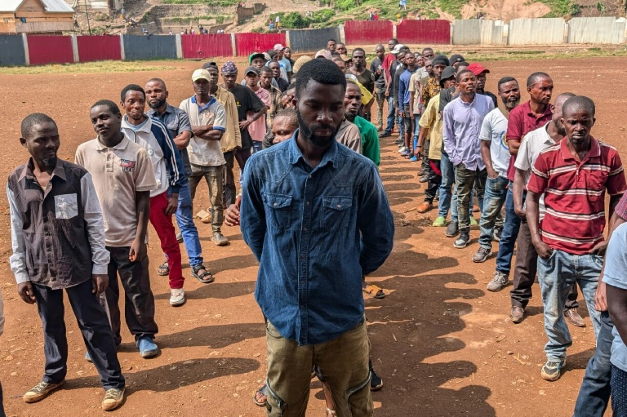Volunteers line up to fight M23 fighters alongside Congolese forces at a stadium in Bukavu