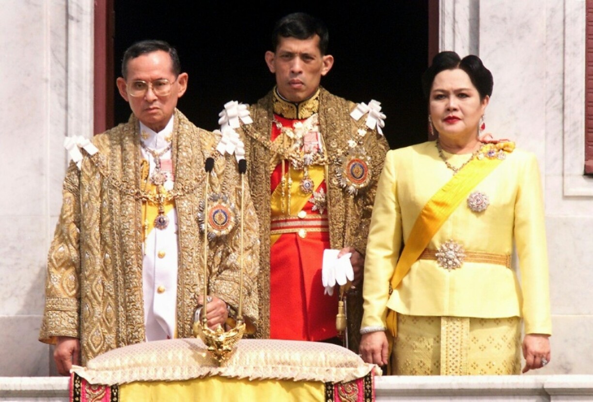 The Thai royal family, (L to R) The Thai royal family (L to R) King Bhumibol Adulyadej, Crown Prince Maha Vajiralongkorn and Queen Sirikit receive respects from attending dignitaries in December 1999