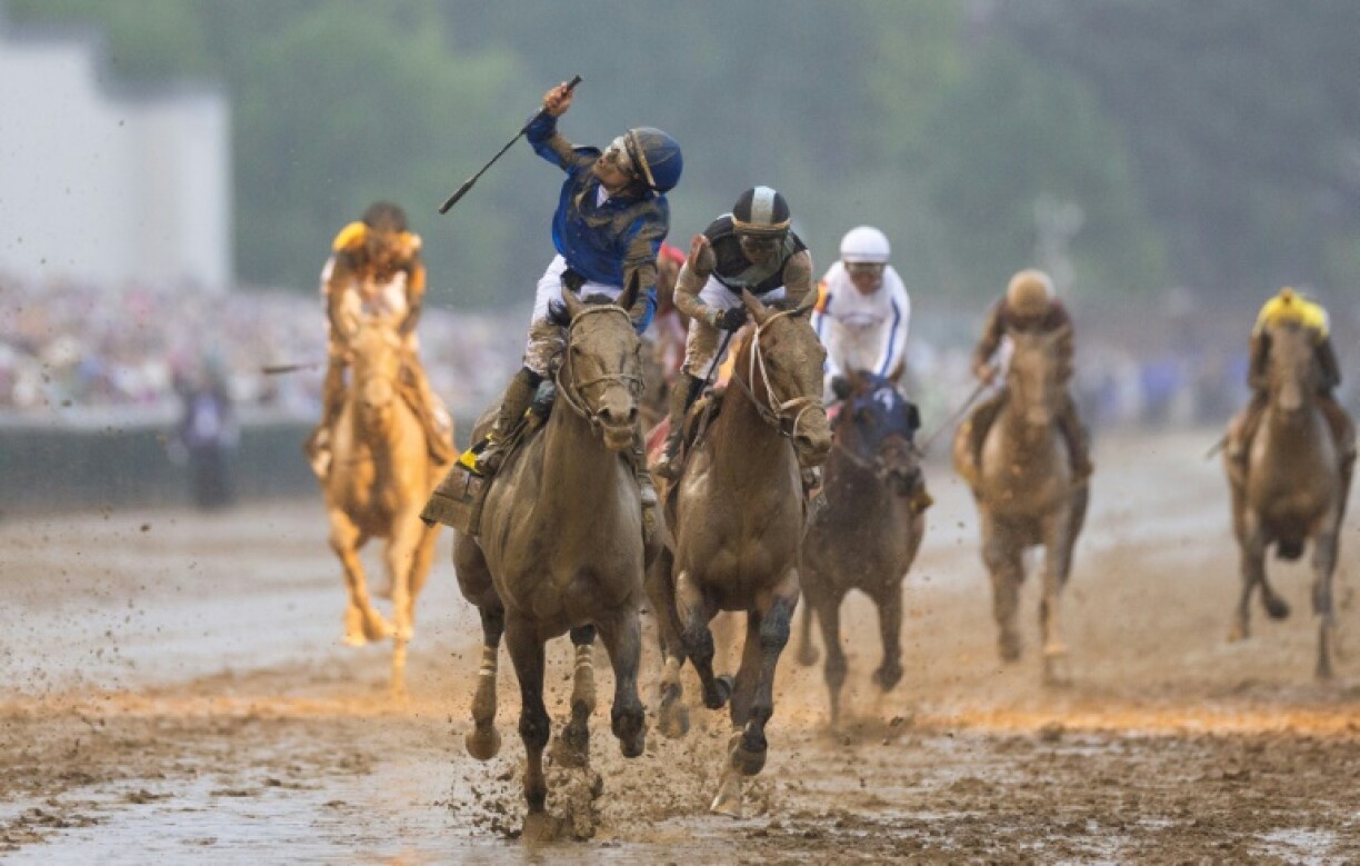 Venezuelan jockey Junior Alvarado rides Sovereignty to victory in the 151st Kentucky Derby