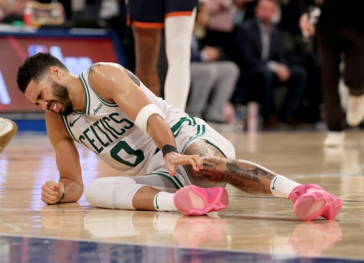 Down and out? Boston's Jayson Tatum grimaces in pain after suffering an injury in the Celtics loss to the Knicks
