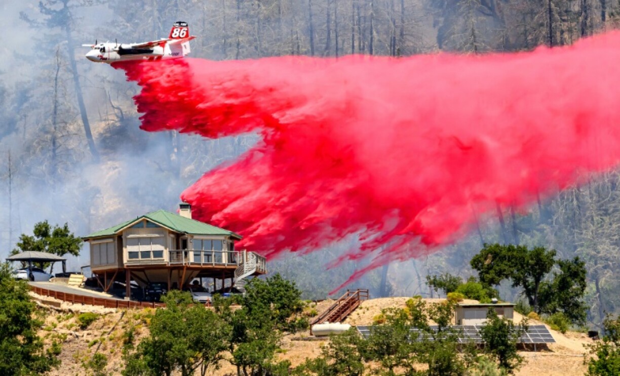 Such retardants have been in use for decades: An air tanker drops some over a house during the Toll fire in California on July 2, 2024