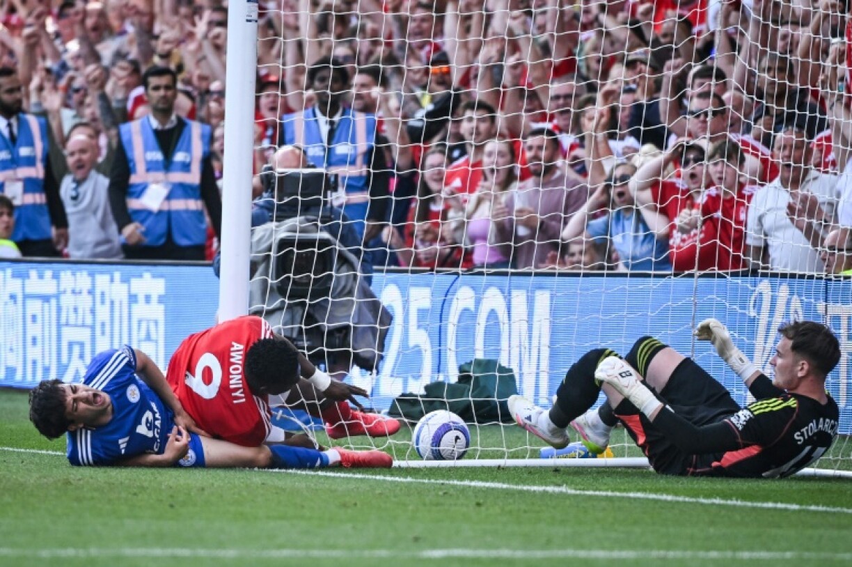 Injured: Nottingham Forest striker Taiwo Awoniyi (C) was hurt after colliding with a post under challenge from Leicester's Facundo Buonanotte (L) while trying to score a winner in a 2-2 draw at the City Ground